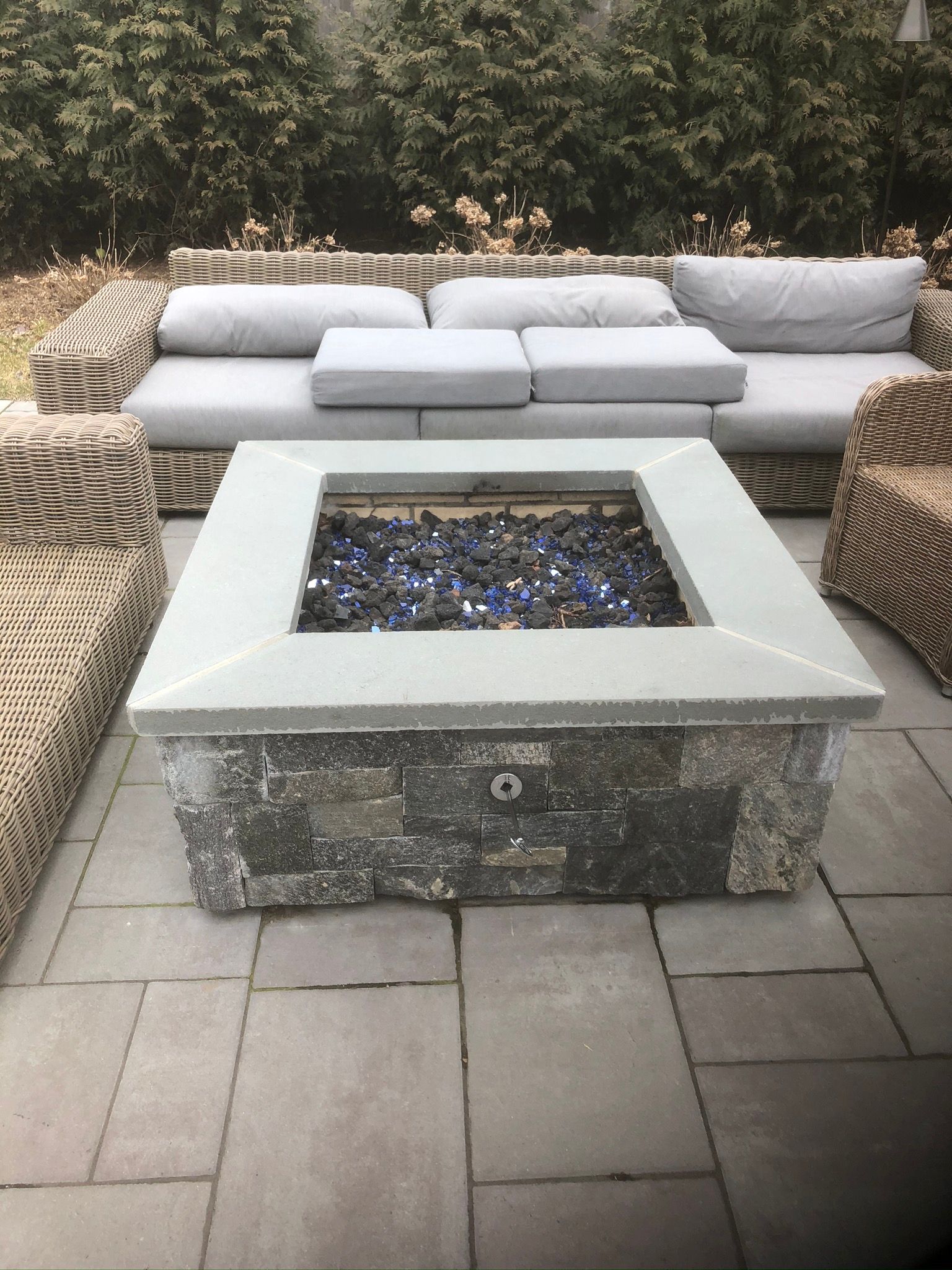 a firepit is sitting on a patio