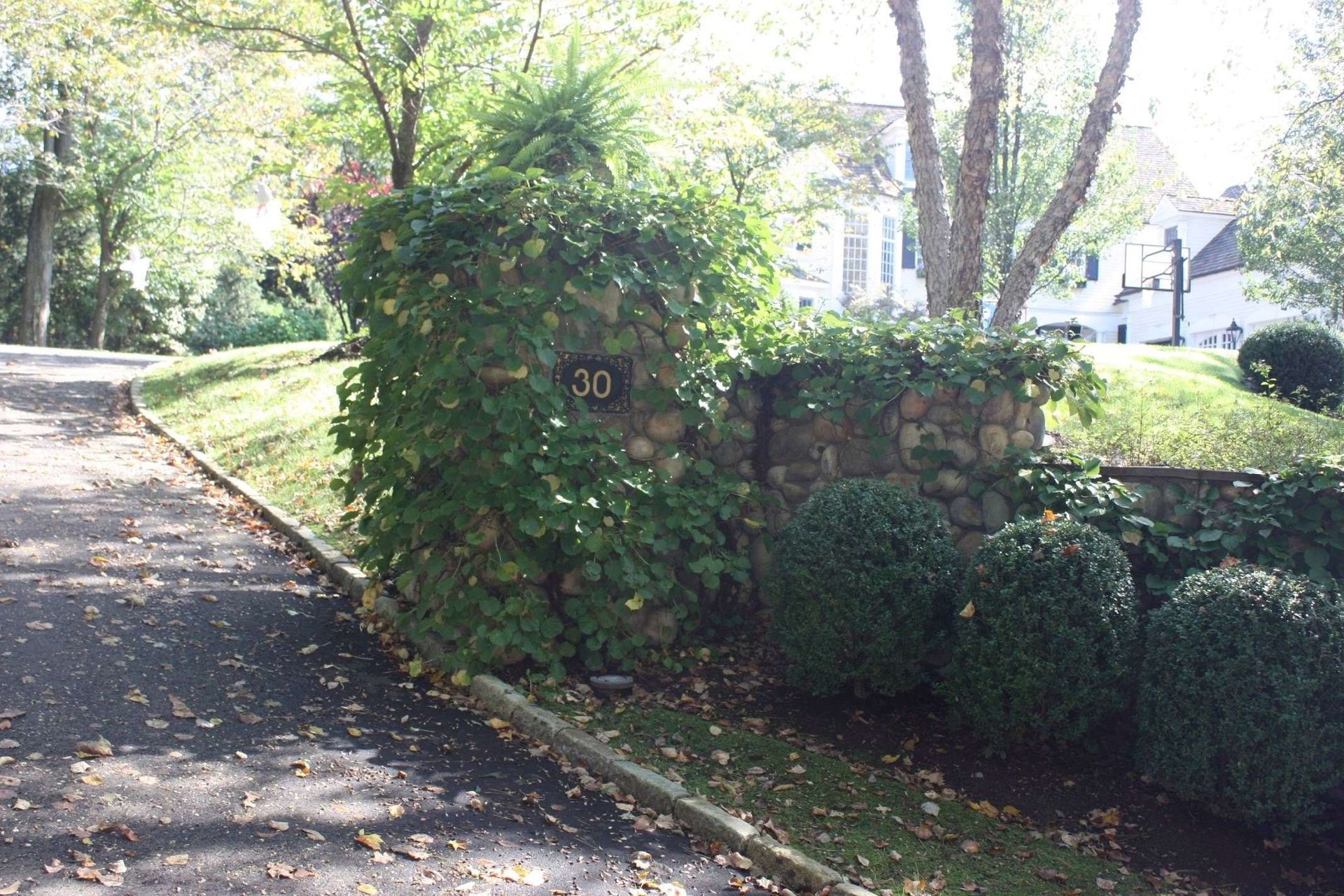 A stone wall with the number 30 on it