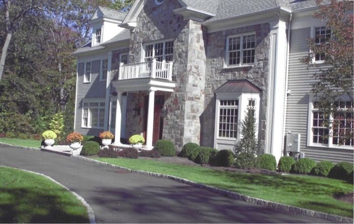 A large house with a driveway leading to it