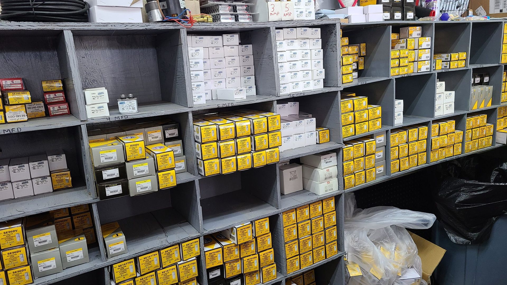A warehouse filled with lots of yellow and white parts.