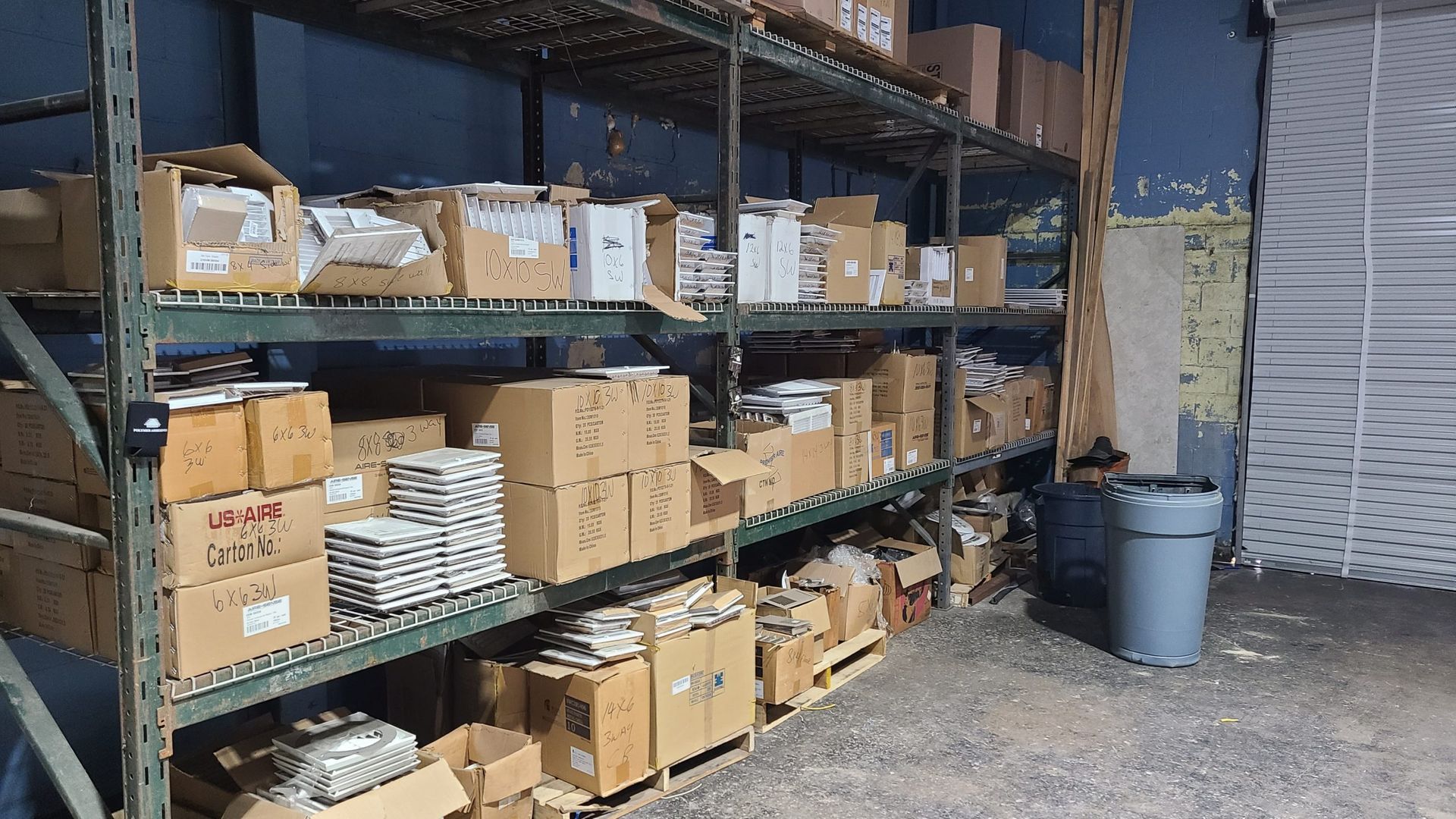 A warehouse filled with lots of boxes and shelves