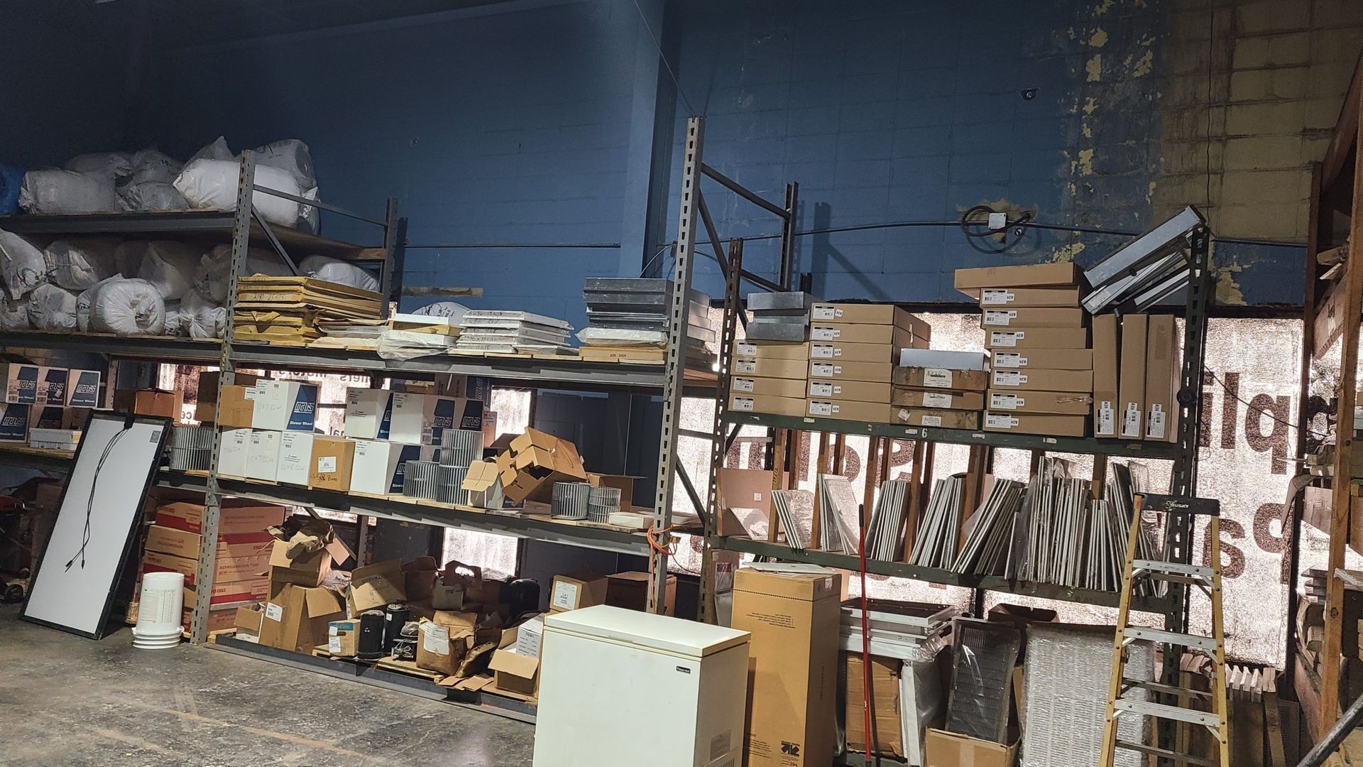 A warehouse filled with lots of shelves and boxes