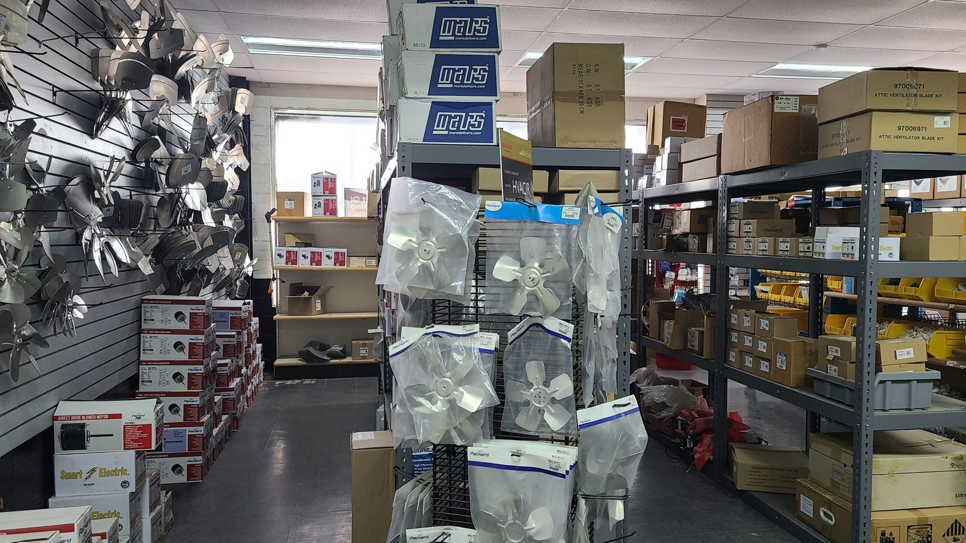 A warehouse filled with lots of boxes and shelves