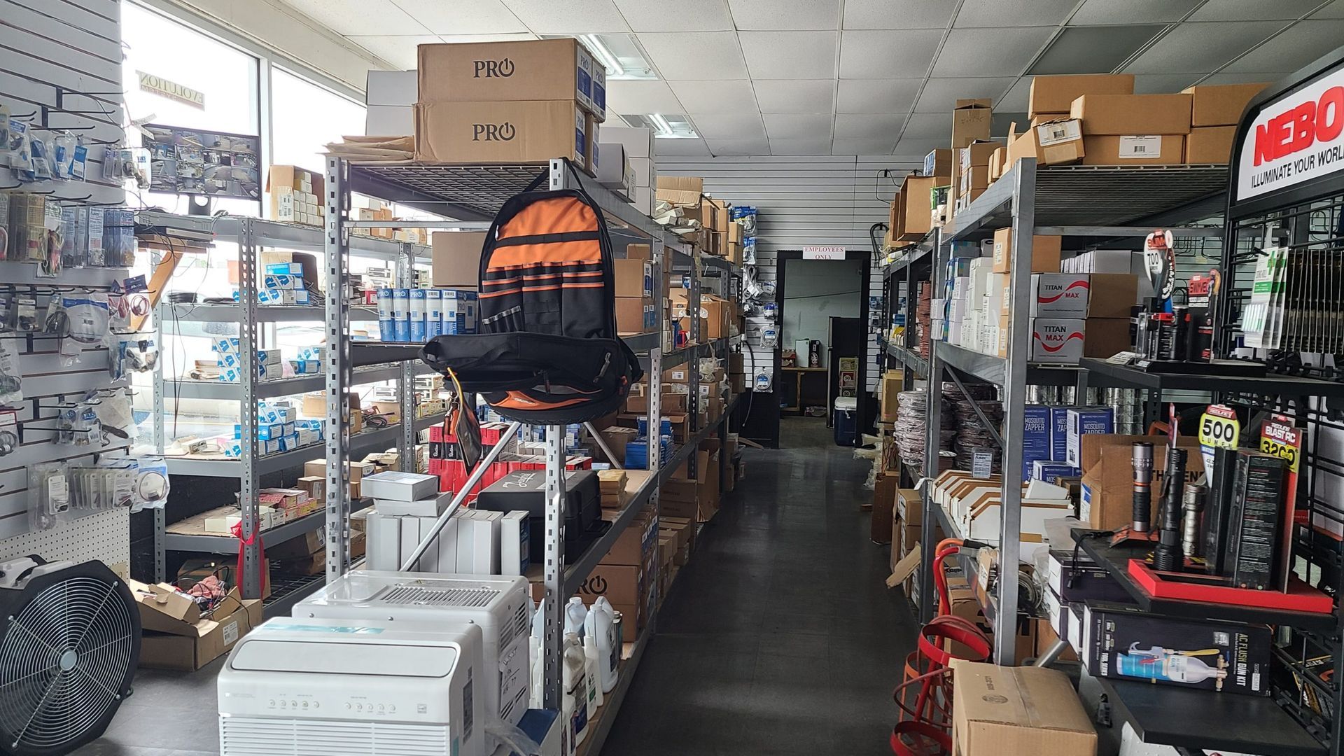 A large warehouse filled with lots of boxes and shelves.