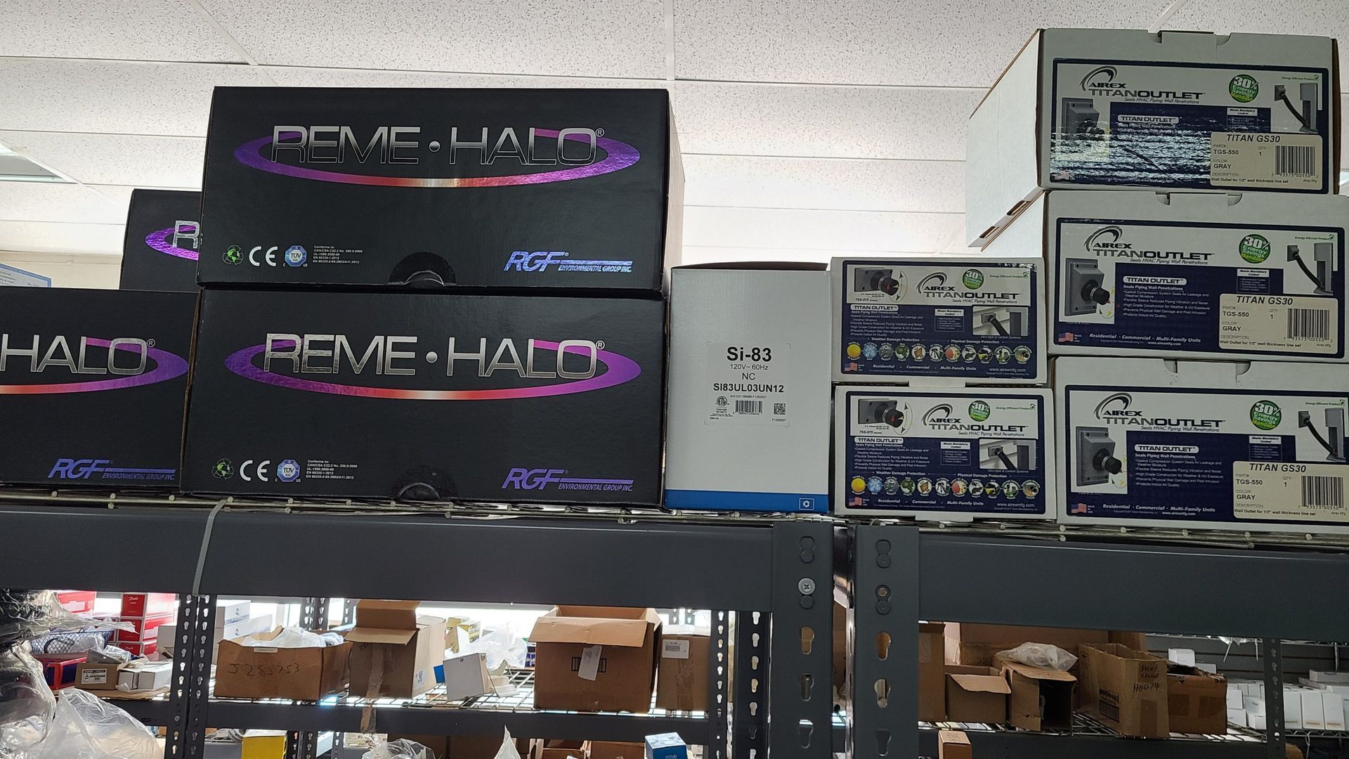 Several boxes are stacked on top of each other and one of them has the word halo on it