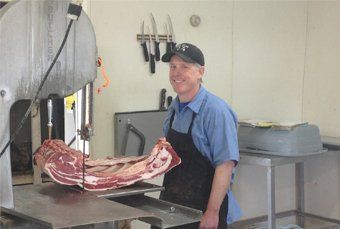 Man with meat and machine