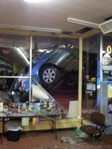 A car that has crashed into a store window
