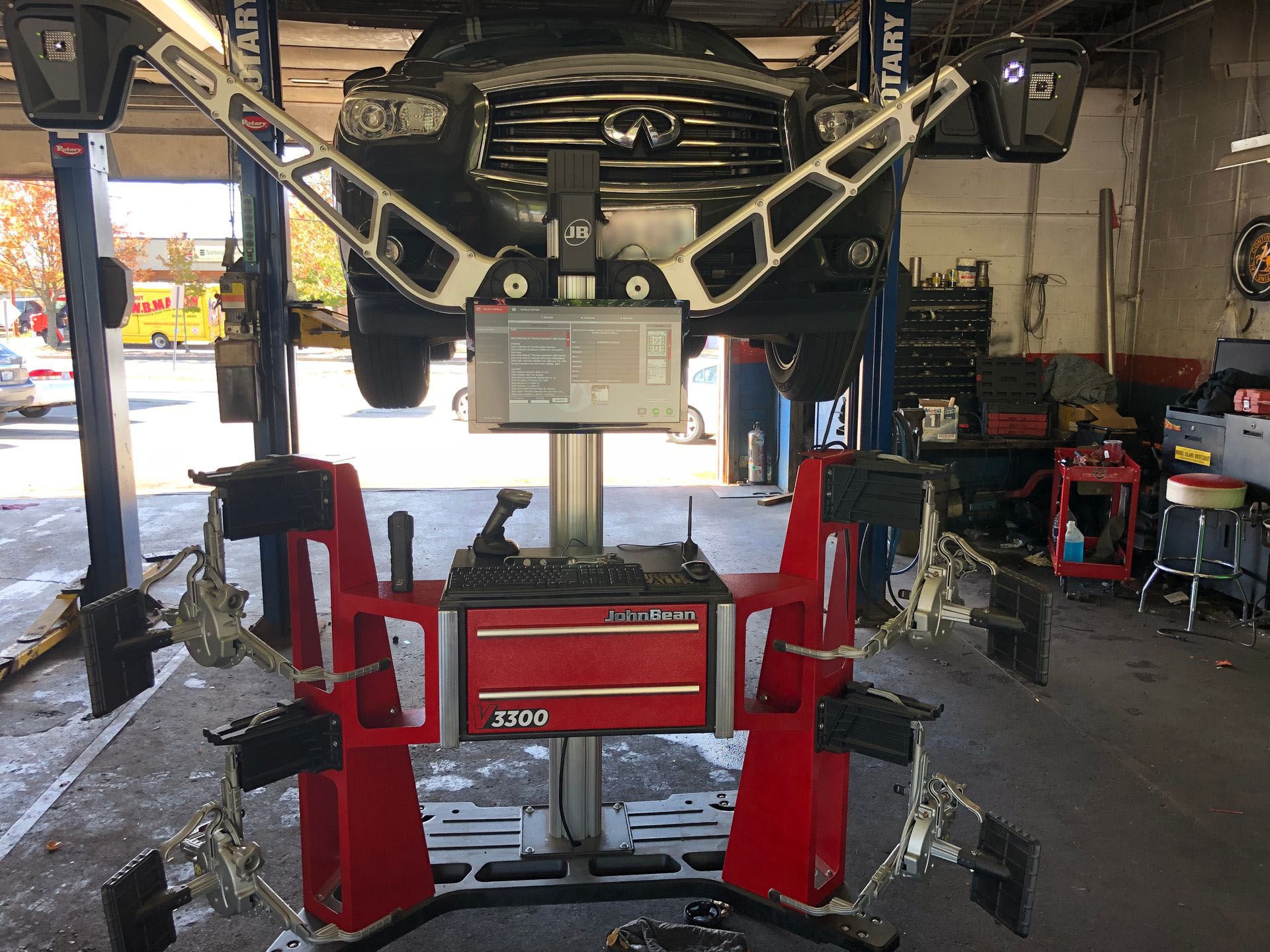 A car is sitting on a machine that says ford on it
