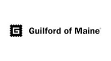 Guilford of Maine logo with black text and emblem on a white background