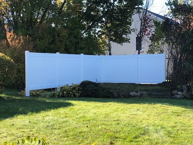 White fence in the yard
