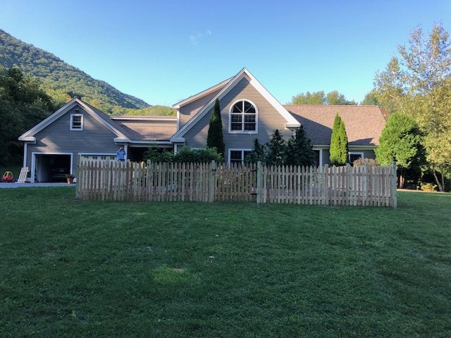 Wooden fence in front of a house