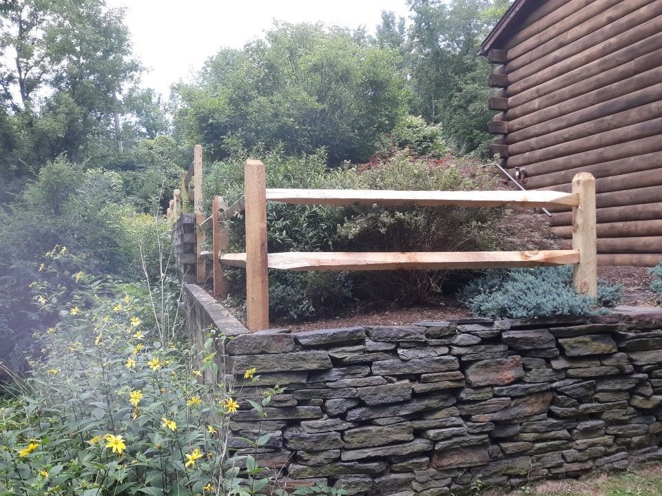 Retaining wall for plants with wooden fence