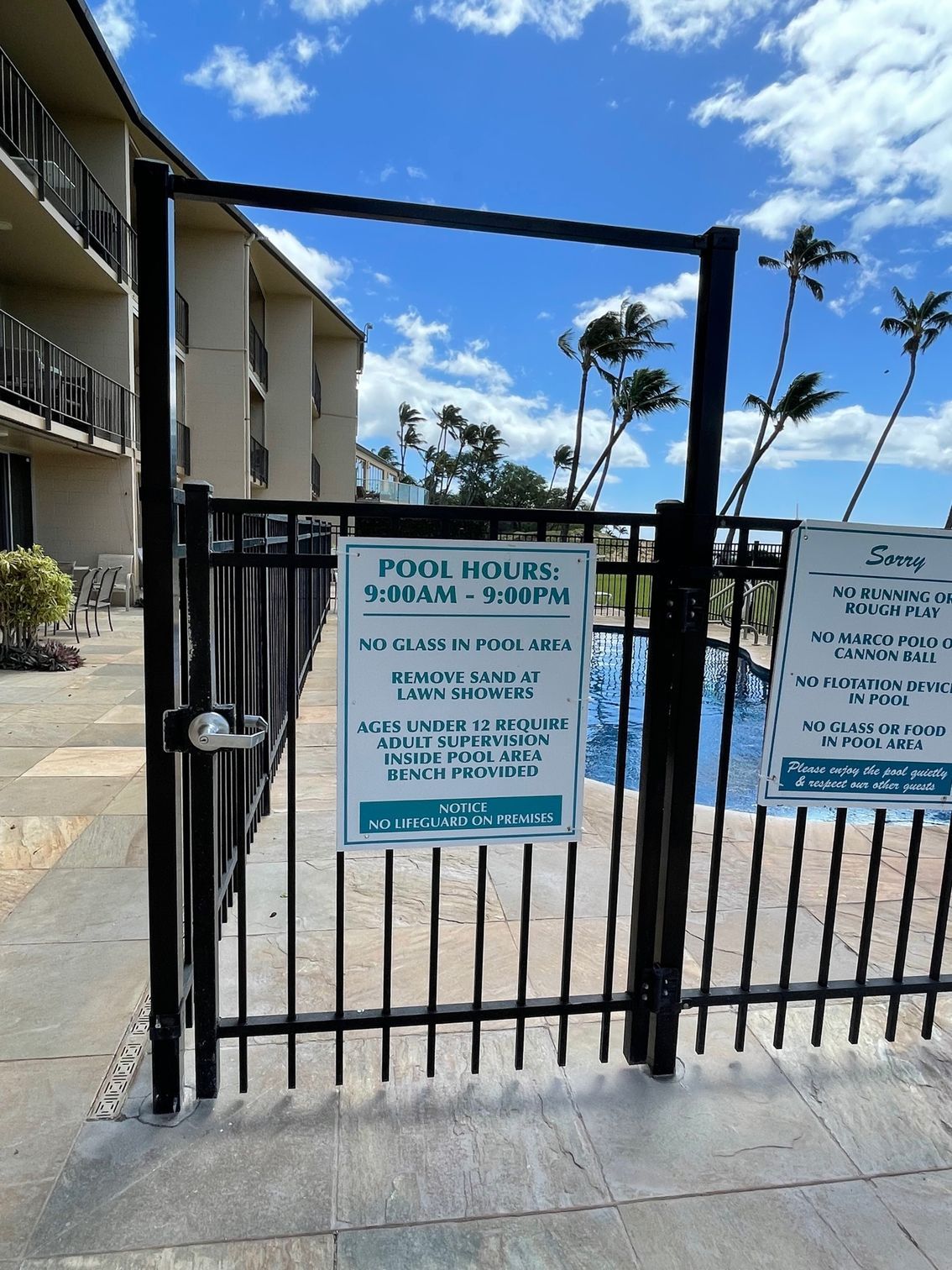 A fence with a sign on it that says push buttons