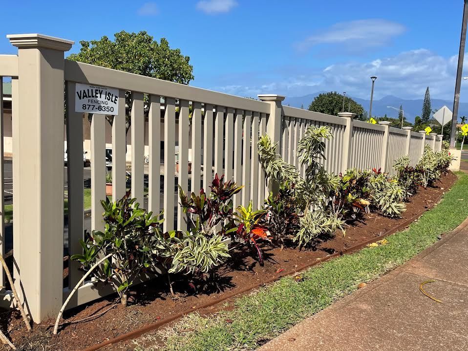 A white picket fence with a sign that says valley view