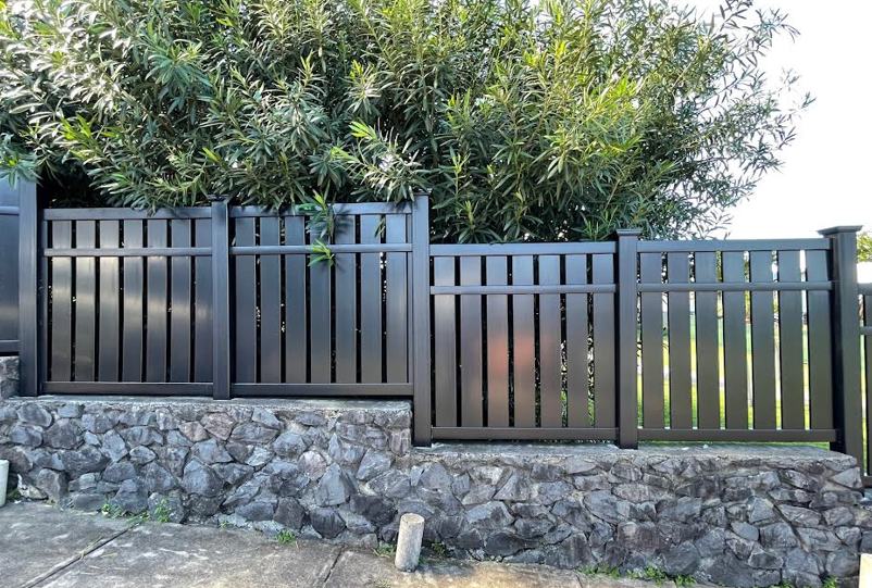 A black vinyl fence