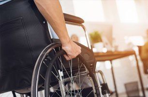 disabled man is sitting in a wheelchair