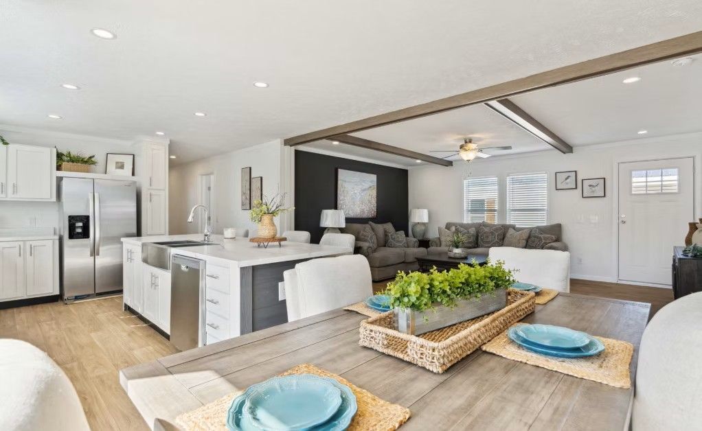 Open-concept living space with kitchen, dining area, and living room in a modern home.