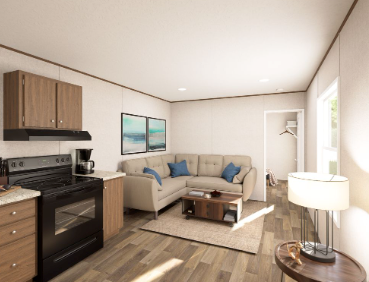 Cozy apartment living room with beige sofa, kitchen area, wood floors, and sunlight from a window
