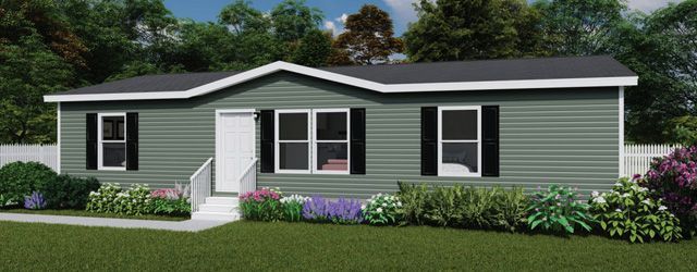 Single-story green house with white trim, front steps, and landscaped flower beds.
