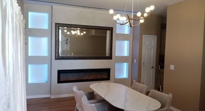 A dining room with a fireplace