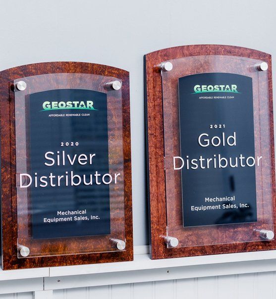 Two plaques that say, silver distributor and gold distributor