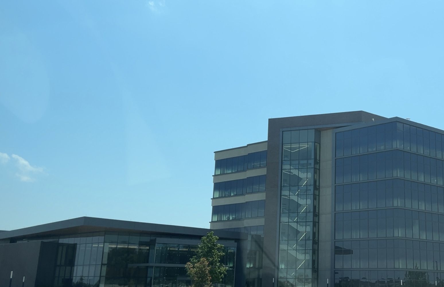Modern office buildings under a clear blue sky