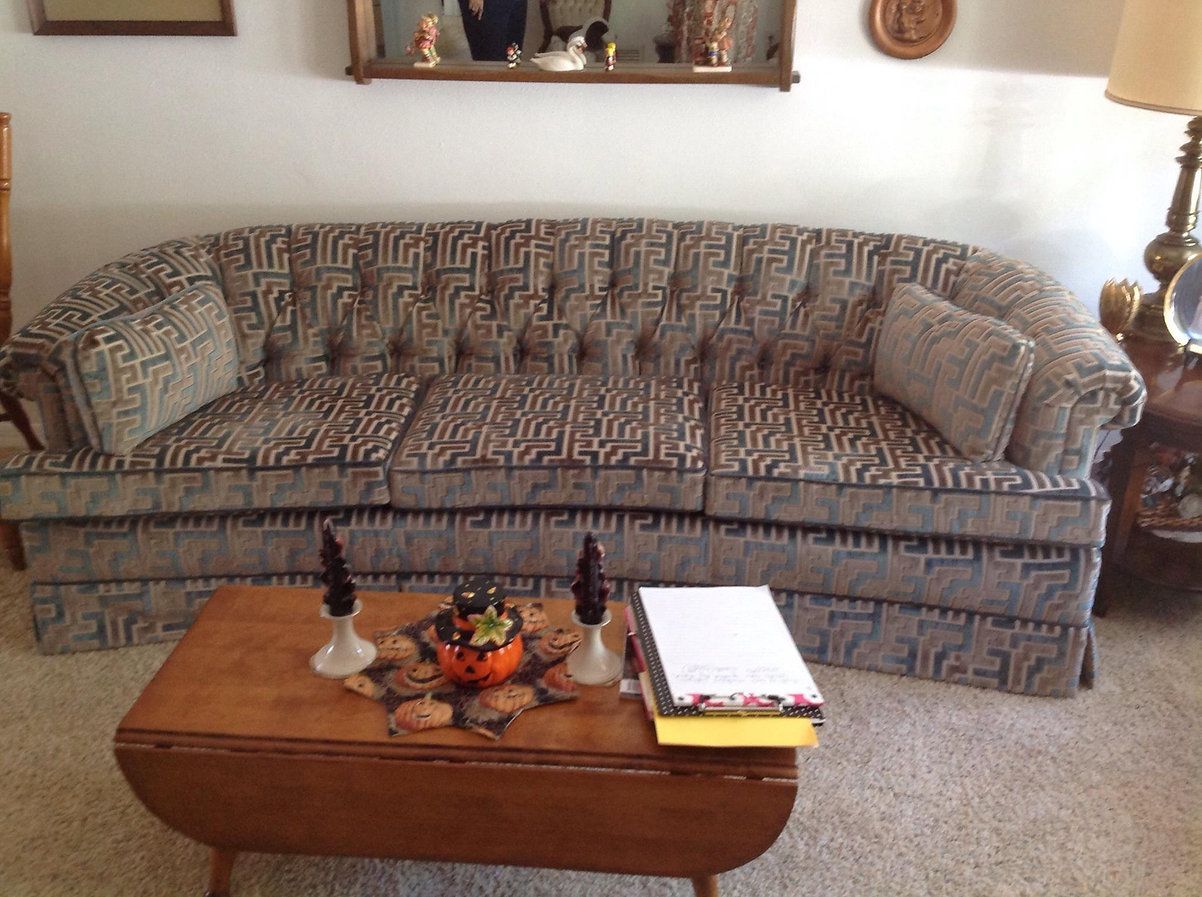 A living room with a couch and a coffee table