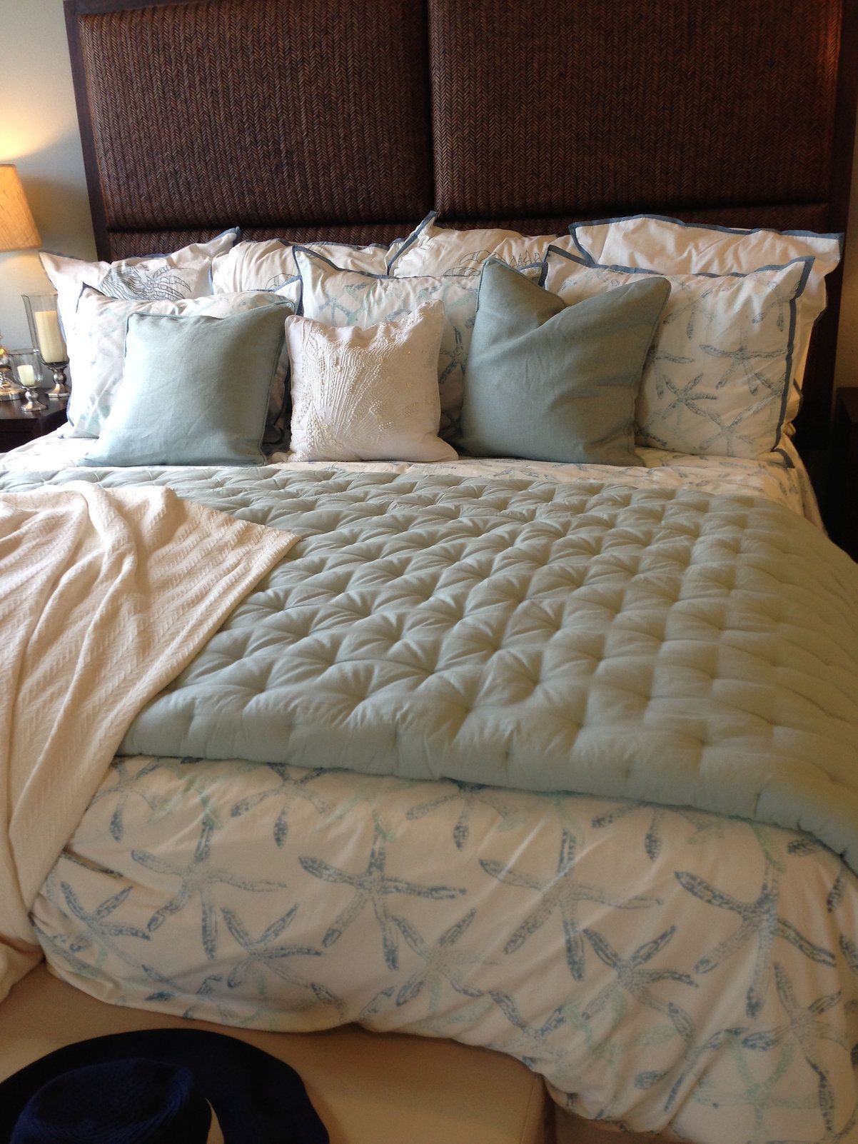 A bed with a quilt and pillows on it