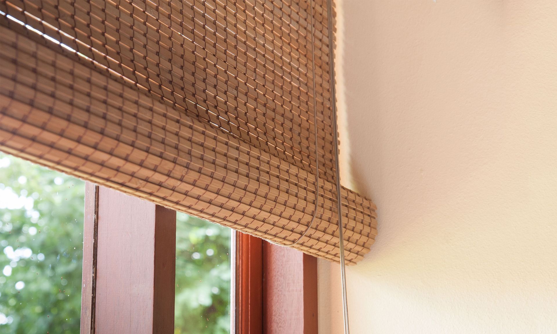 A close up of a window with a blind on it