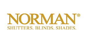 The logo for norman shutters, blinds, and shades.
