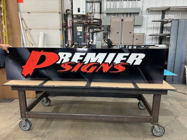 A sign that says Premier Signs on it