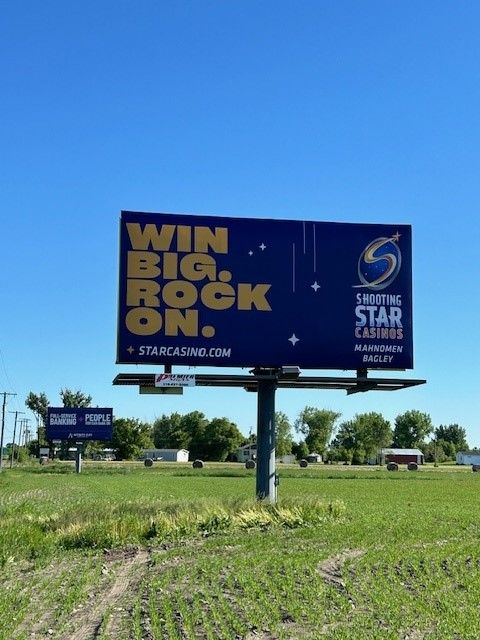 A billboard that says win big rock on