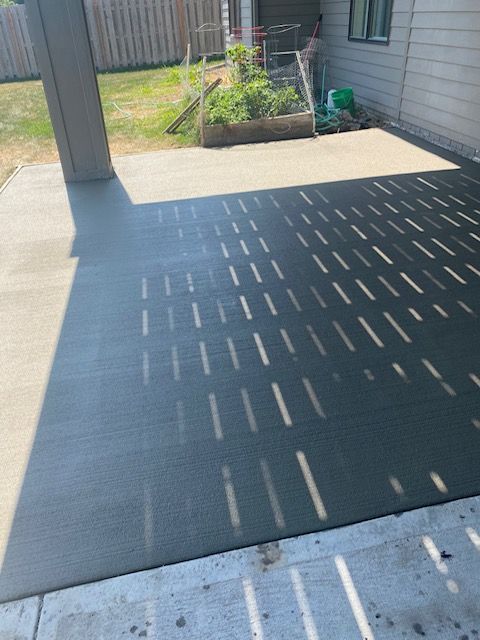 A shadow of a person is cast on a concrete surface