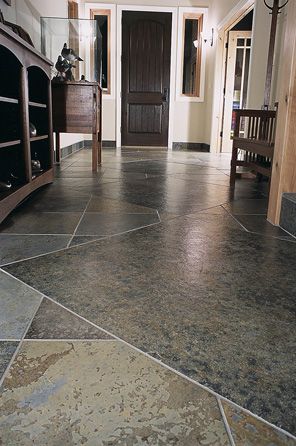 A hallway with a tiled floor and a wooden bench.