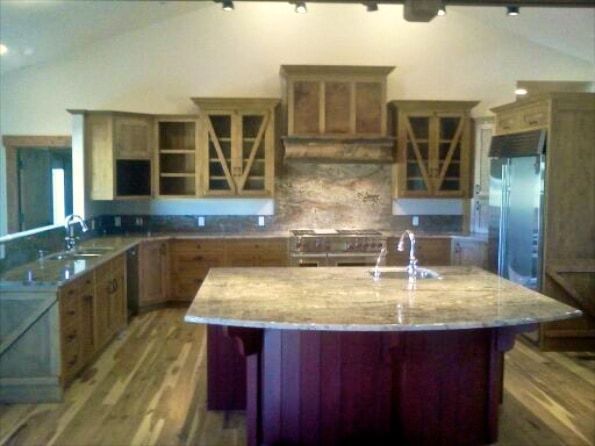 A kitchen with a large island in the middle