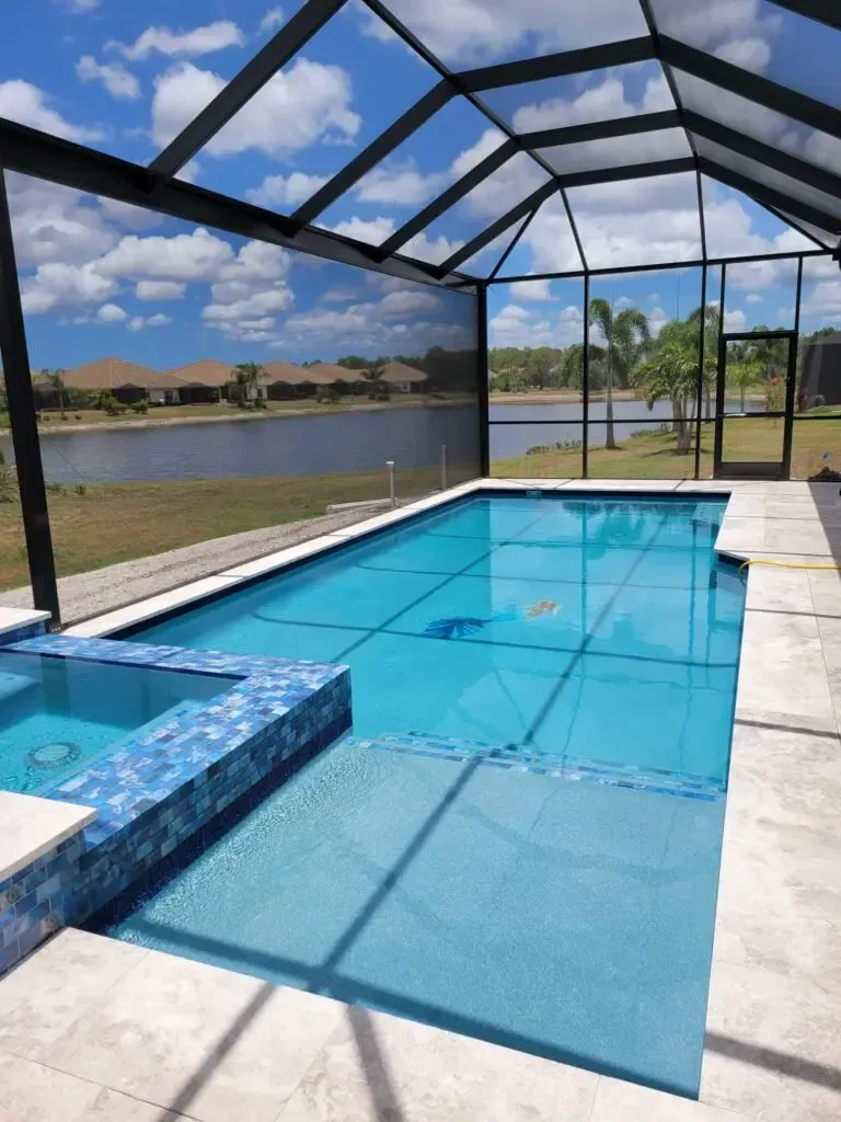 A large swimming pool with a view of a lake