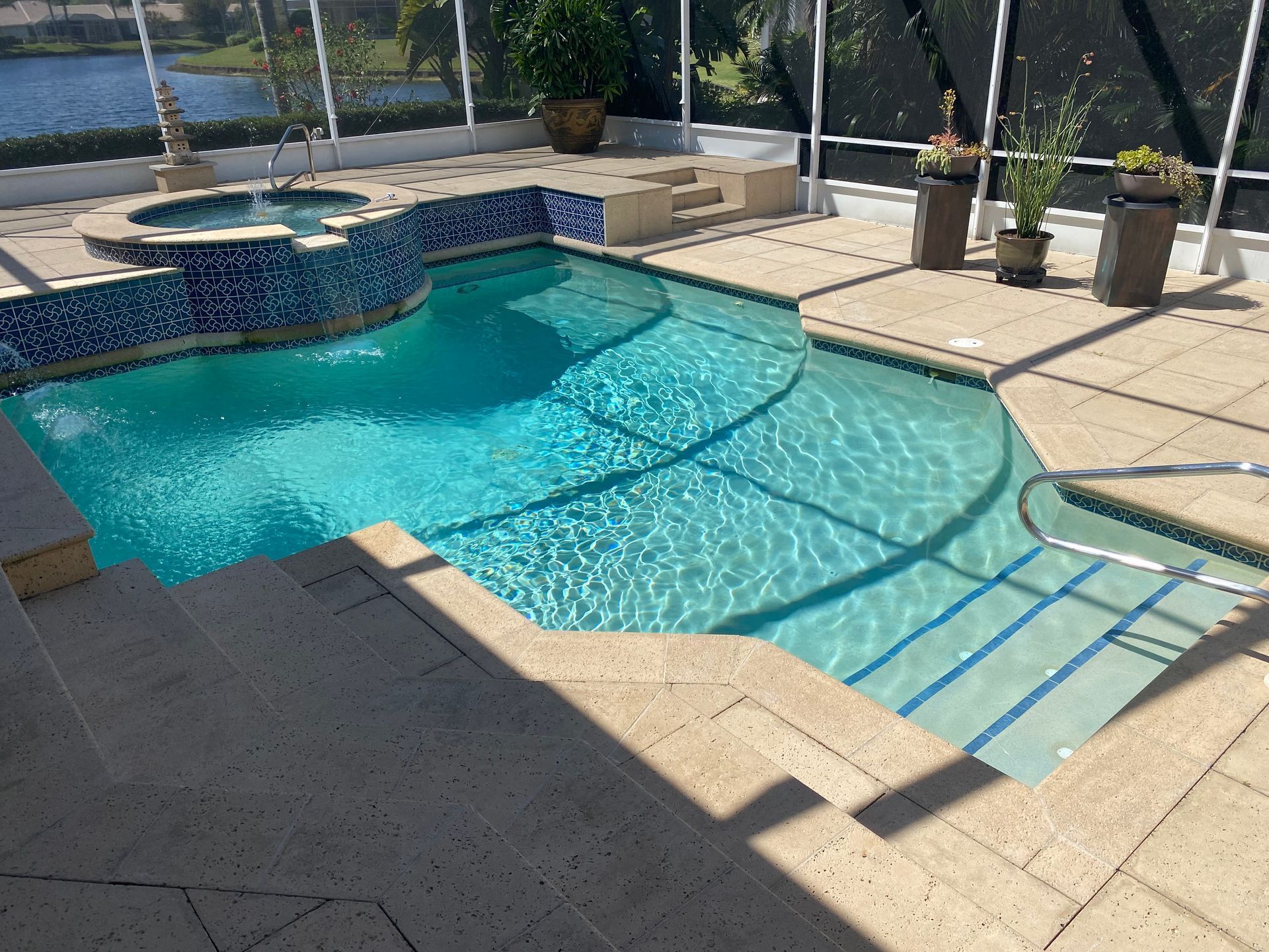 A large swimming pool with stairs leading to it.
