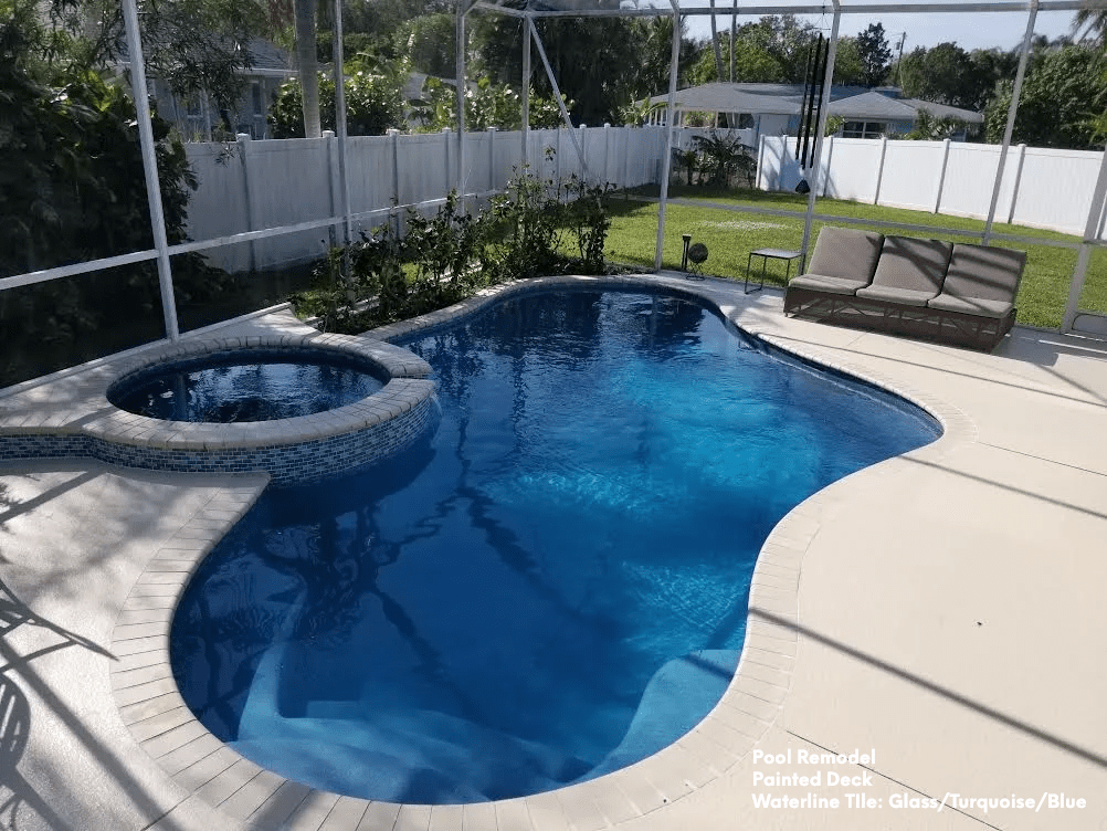 A large swimming pool with a hot tub in the middle