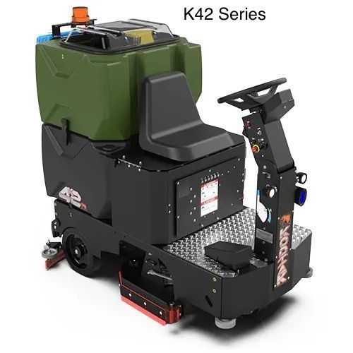 A machine that looks like a scooter is sitting on a white surface.