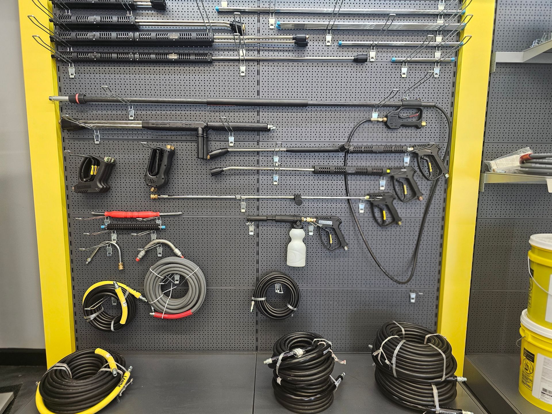 A wall with a bunch of tools hanging on it