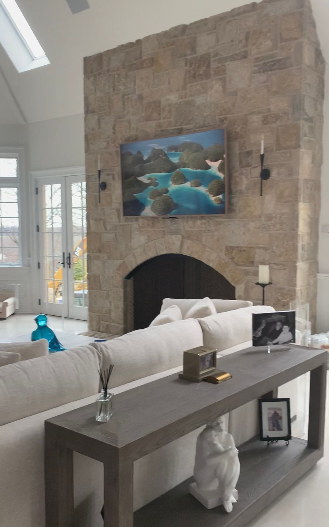 There are two chairs and a table in the room.