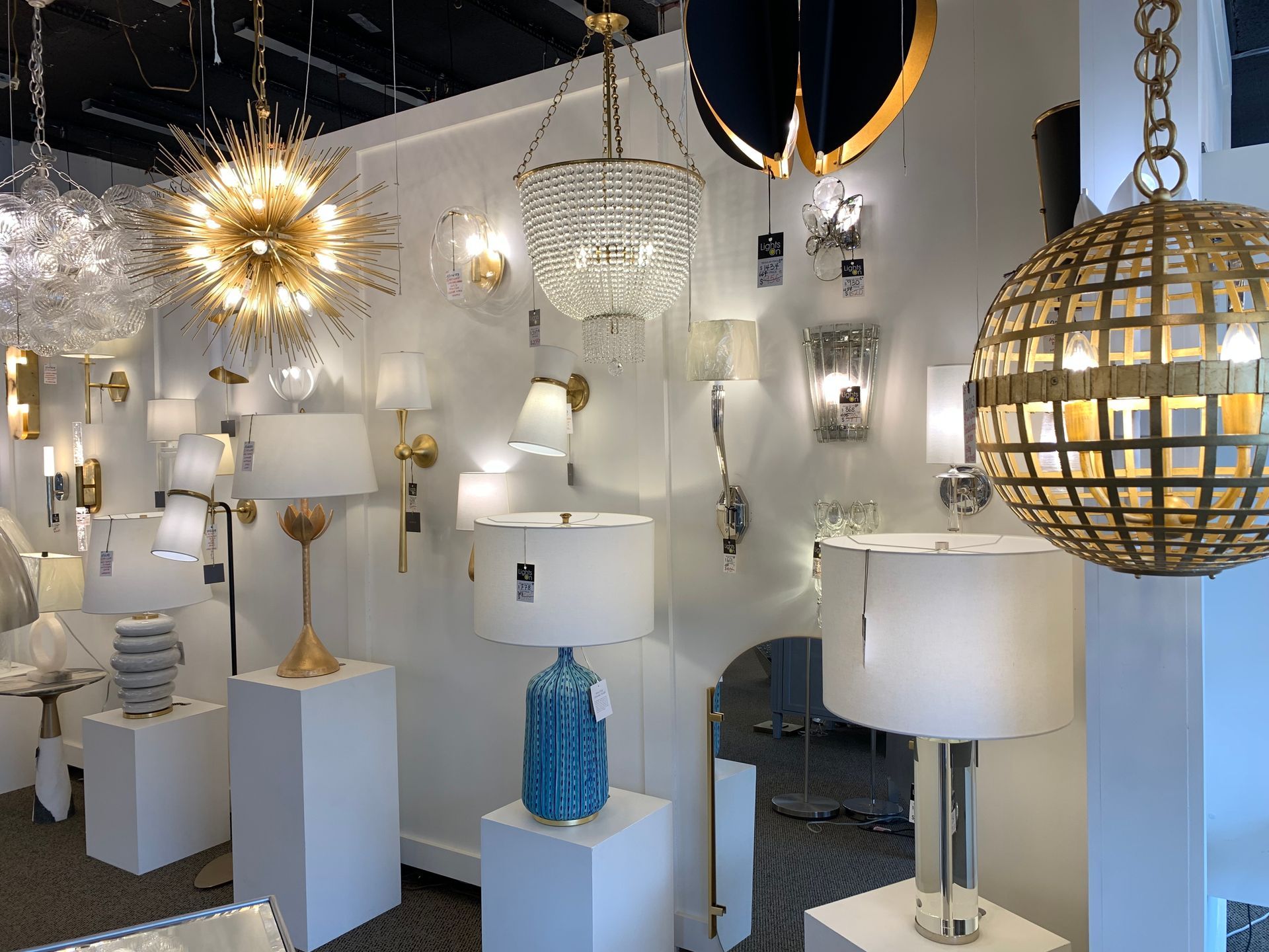 A store filled with lots of lamps and chandeliers.