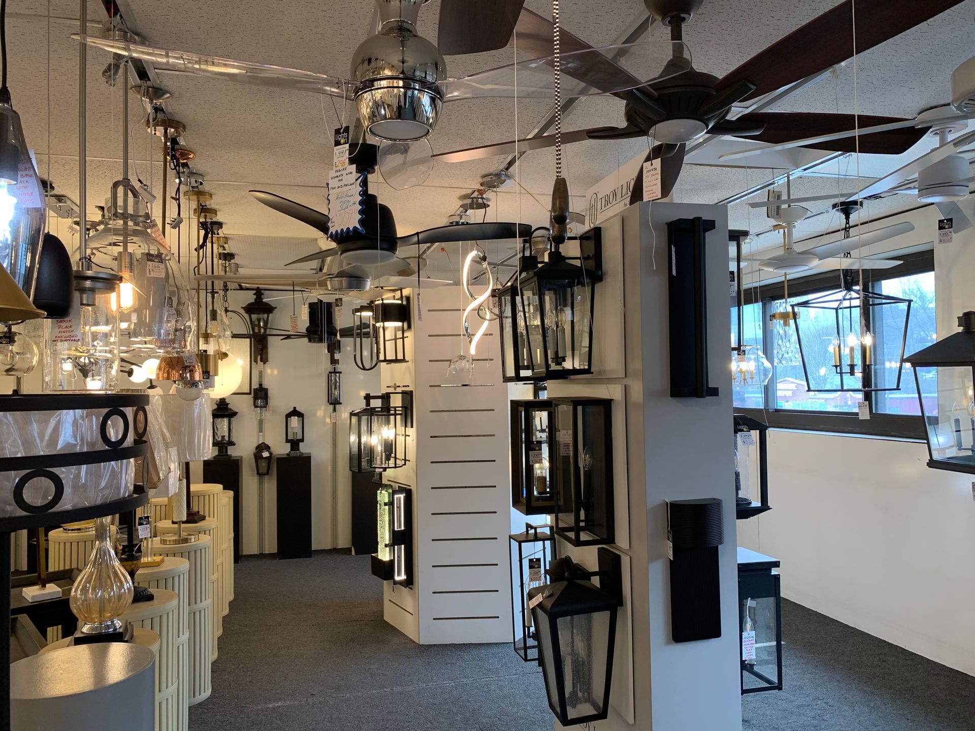 A store filled with lots of lights and ceiling fans.