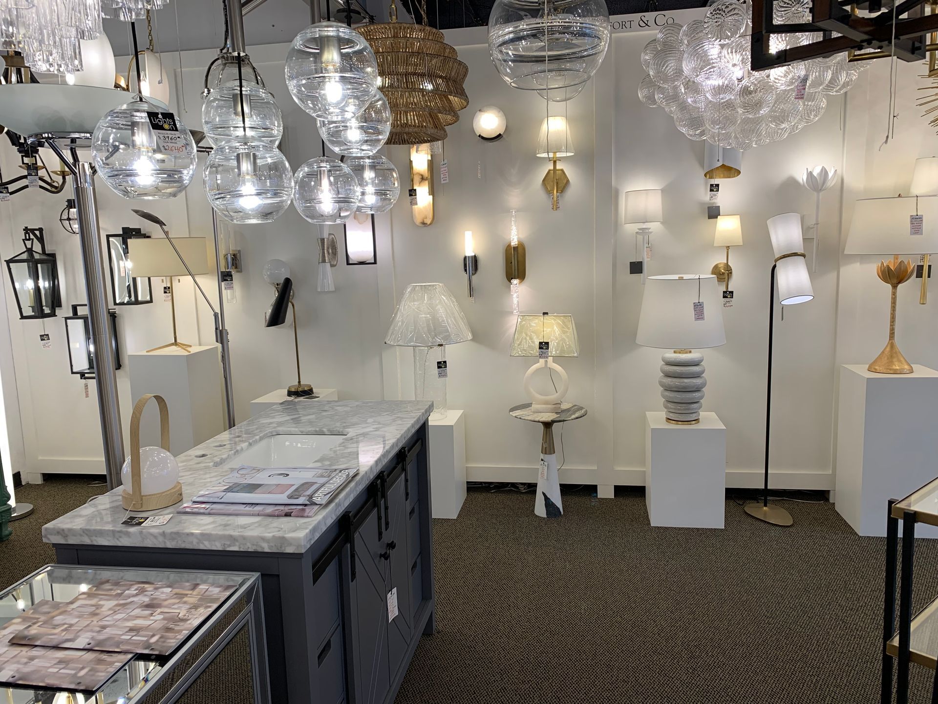 A store filled with lots of lamps and chandeliers.