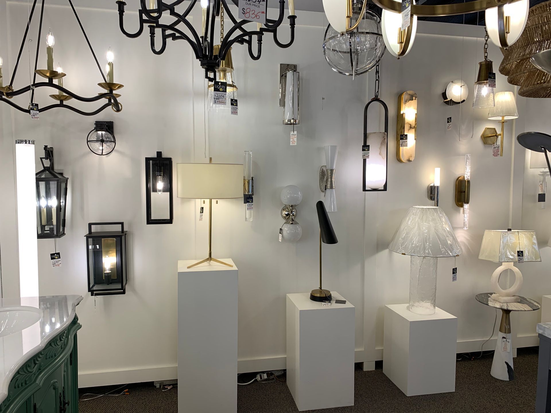 A room filled with lots of lamps and chandeliers.