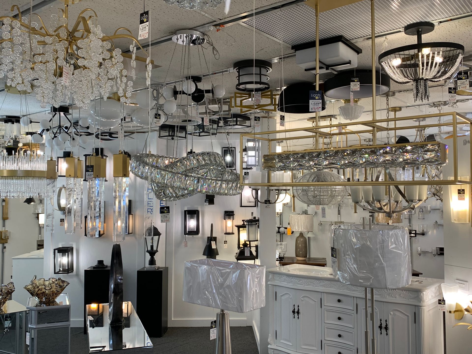 A large room filled with lots of lamps and chandeliers.