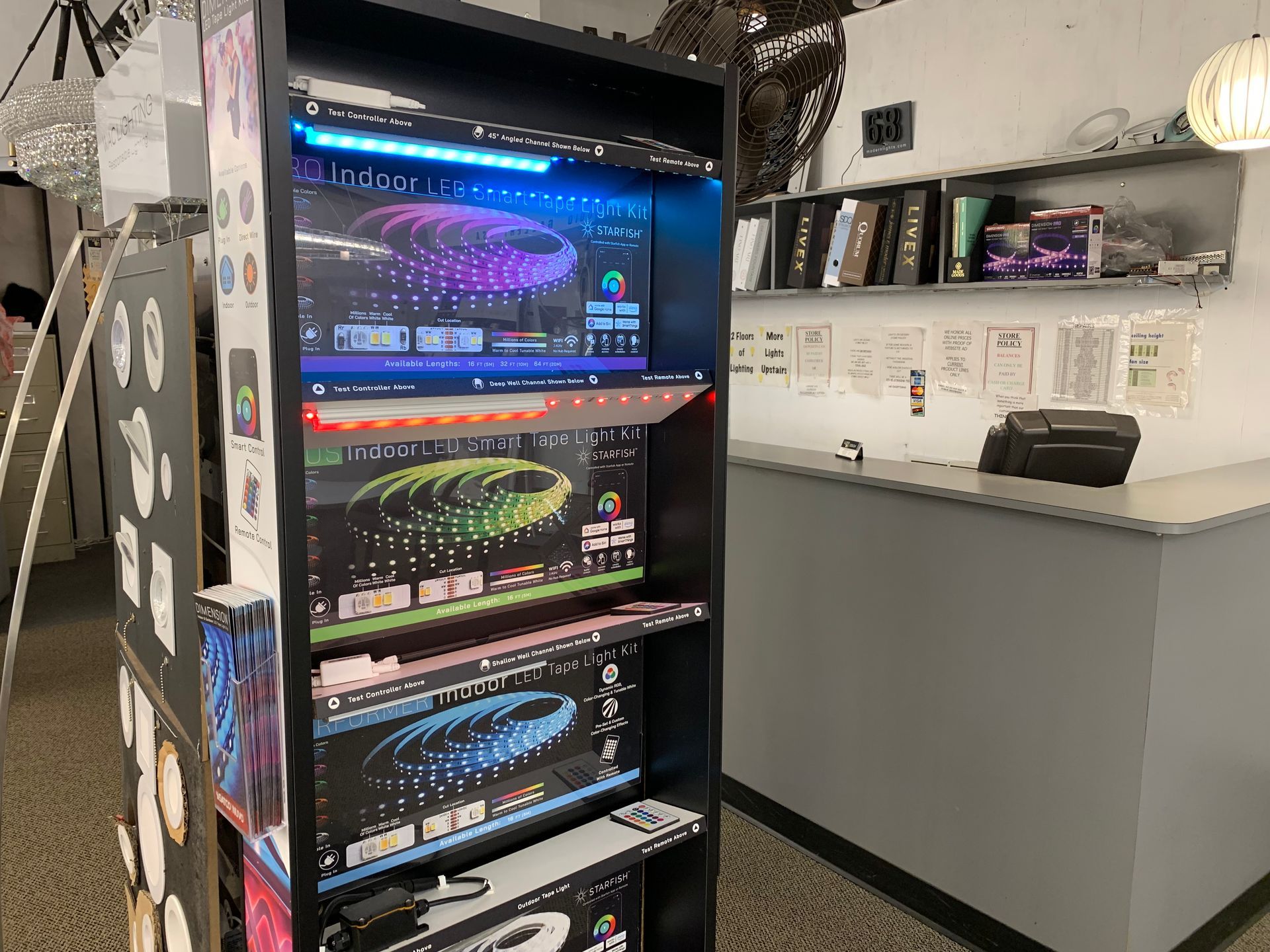 A display case filled with boxes of lights in a store.
