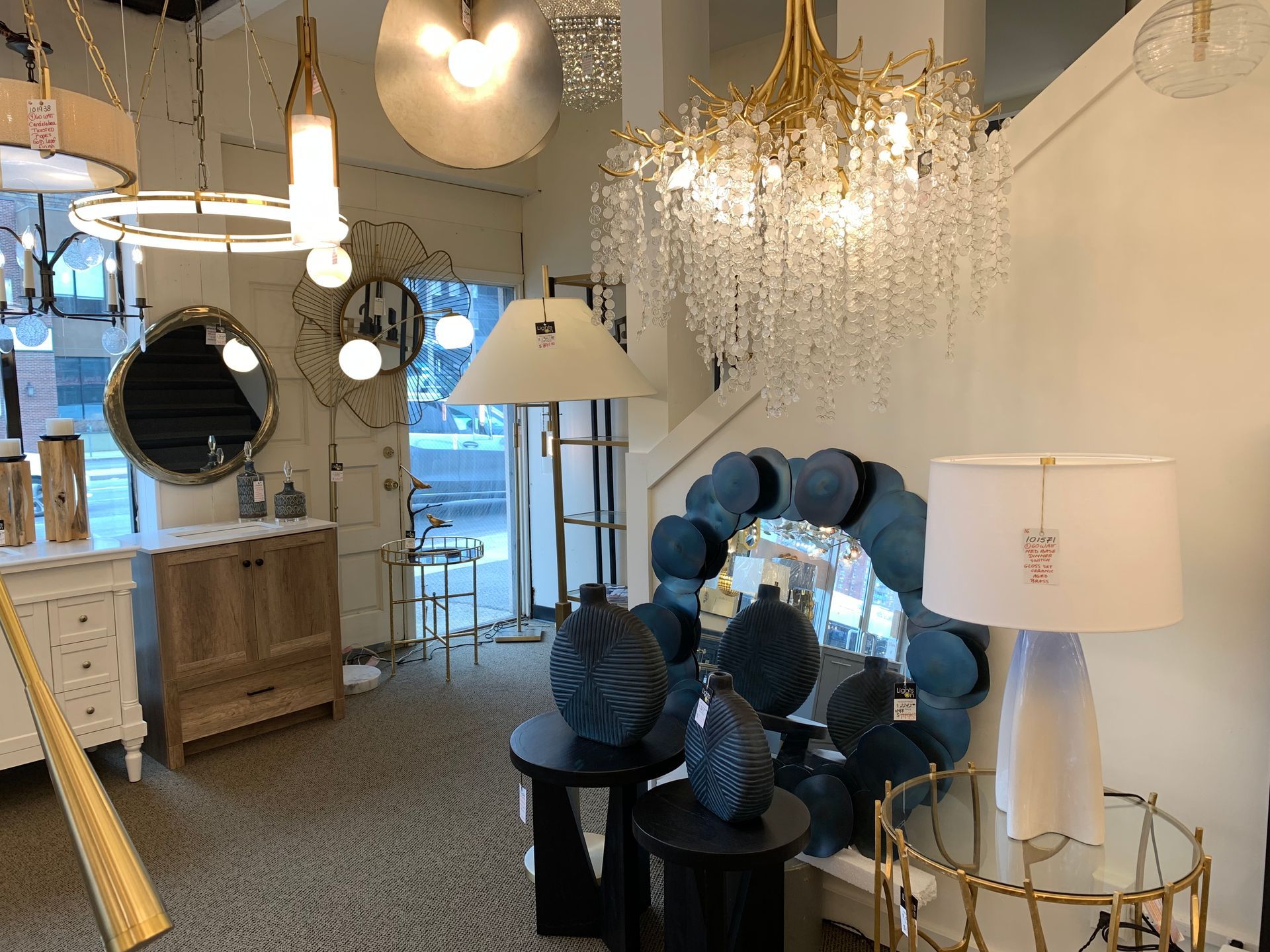 A room filled with lots of lamps and chandeliers.