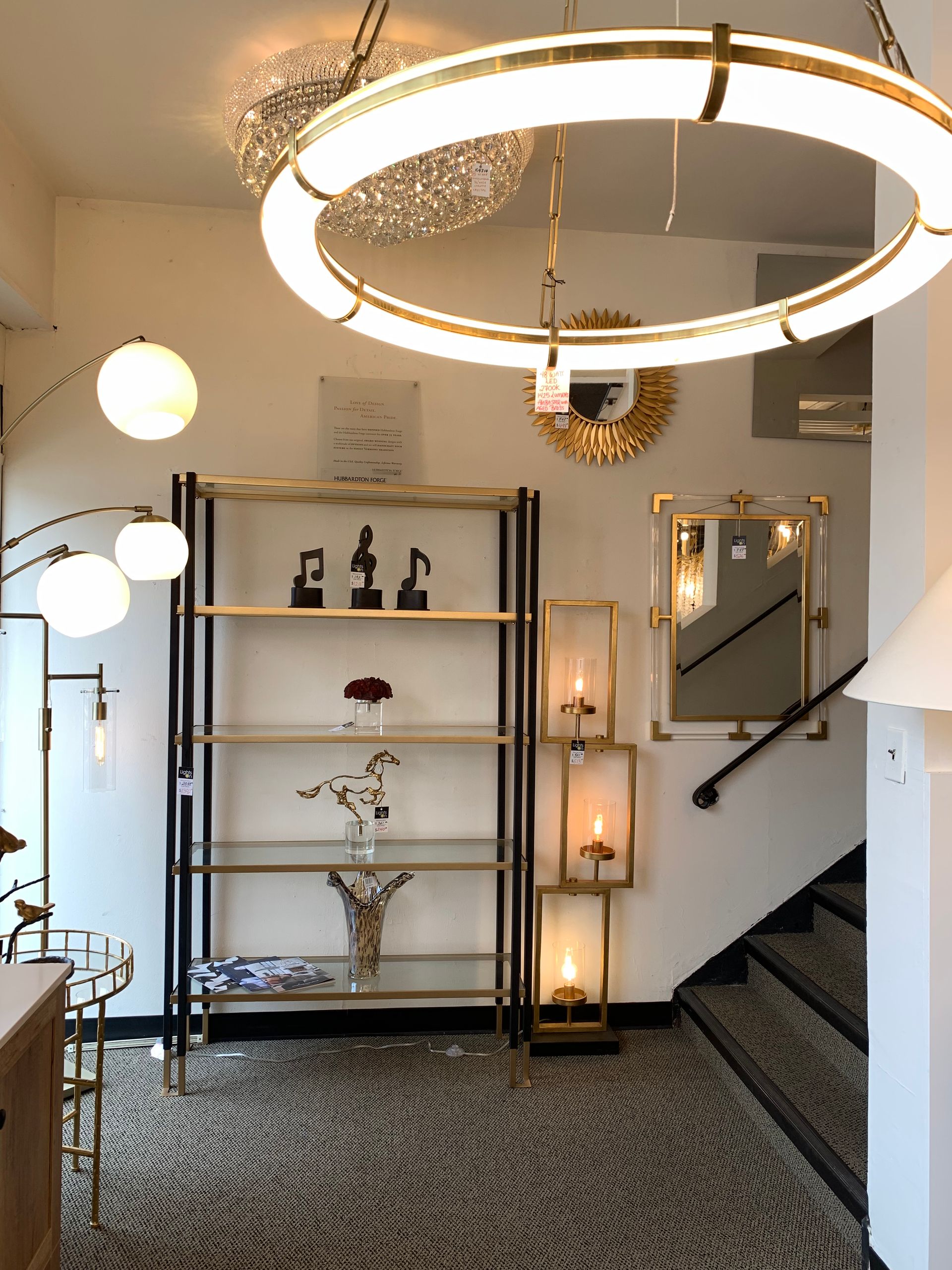A room with a staircase and a shelf with candles on it