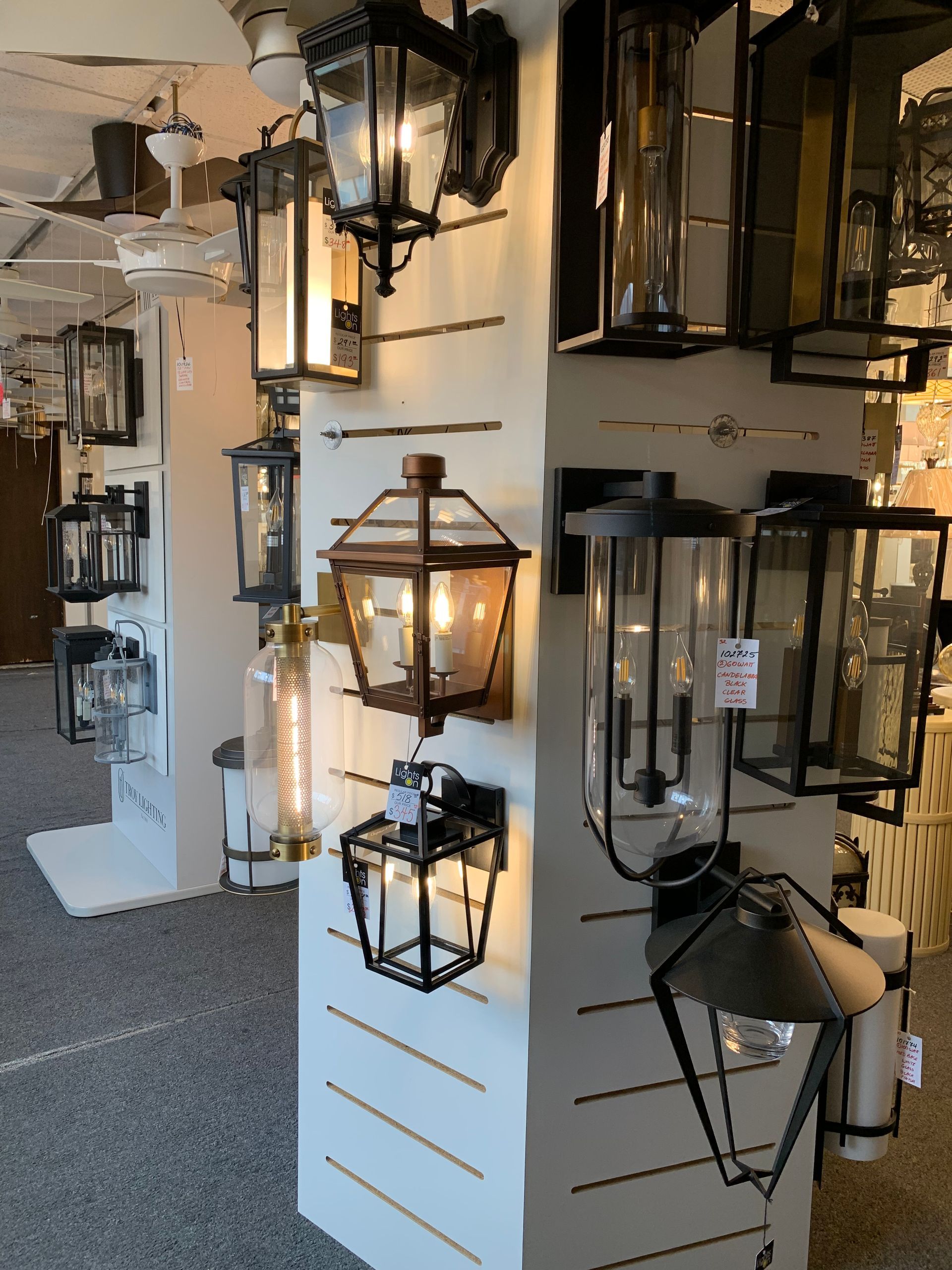 A display of lanterns on a wall in a store
